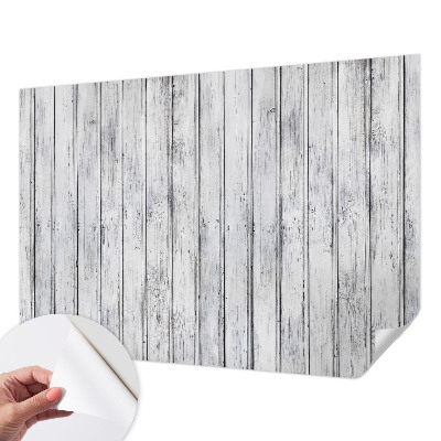 Removable wall mural with a wooden boards pattern