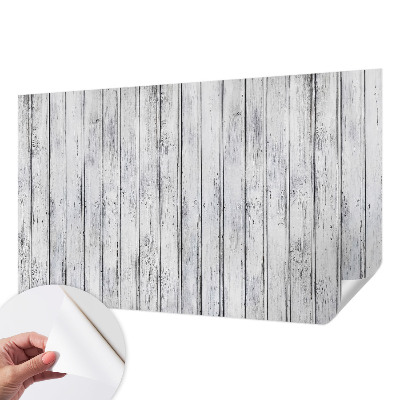 Removable wall mural with a wooden boards pattern