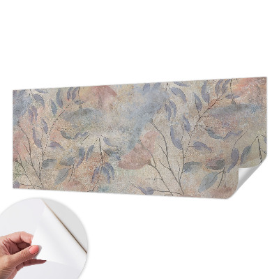 Removable wall mural with an abstract leaves design
