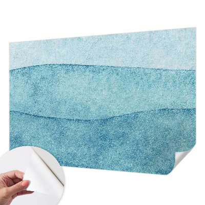 Peel and stick wallpaper mural with a blue waves design