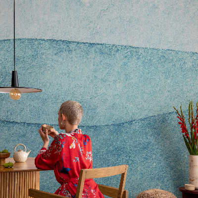 Peel and stick wallpaper mural with a blue waves design