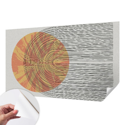 Stick-on wall mural with a circular motif and linear accents