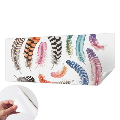 Nursery wall mural with a pastel feather pattern