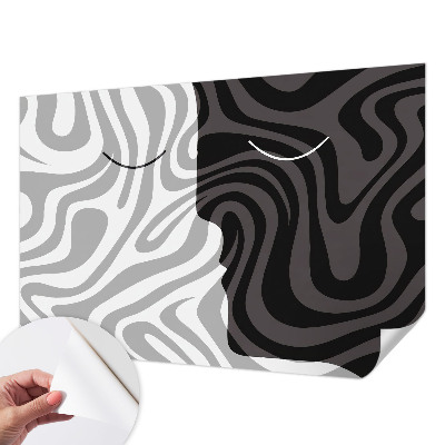 Stick-on wall mural with an abstract faces design