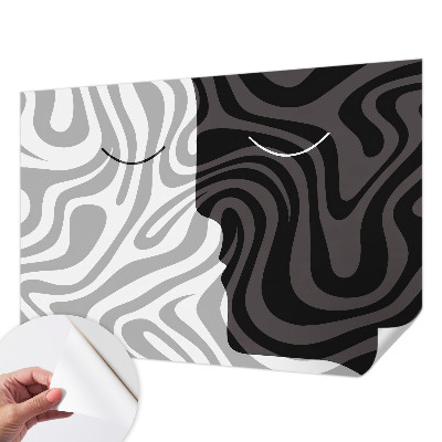 Stick-on wall mural with an abstract faces design