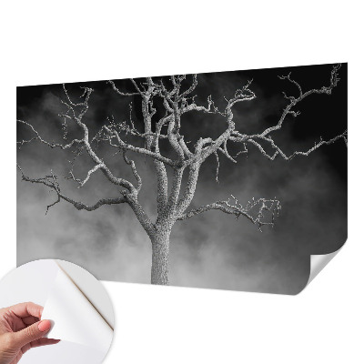 Nursery wall mural with a misty tree design