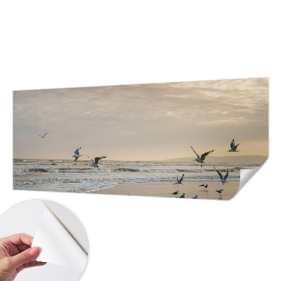 Baby room wall mural with a seaside tranquility design