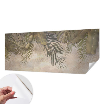 Baby room wall mural with a tropical leaves motif