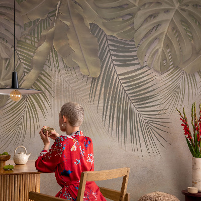 Baby room wall mural with a tropical leaves motif