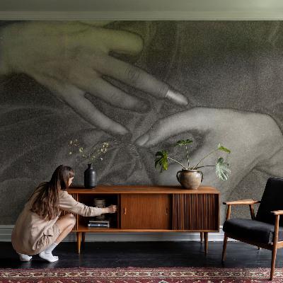 Removable wall mural with a hands motif made from a soft, removable material