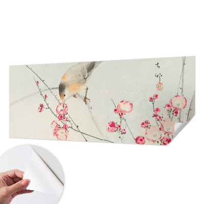 Peel and stick wall mural with a floral and bird design