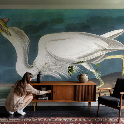 Removable wall mural with a bird holding a fish design