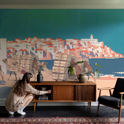 Peel and stick wall mural featuring a camel caravan motif for the living room