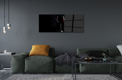 Acrylic print Black background with a glass of wine
