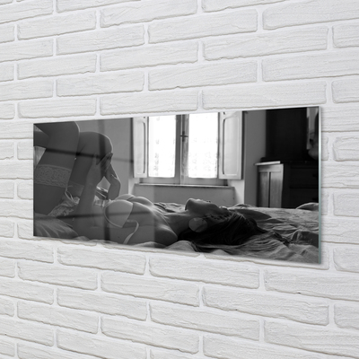 Acrylic print Woman lying on the window