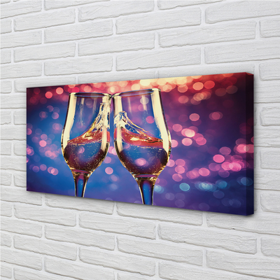 Canvas print Glasses of champagne colored background