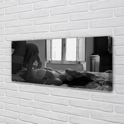 Canvas print Woman lying on the window