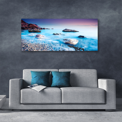 Canvas print Sea stones beach landscape blue grey pink