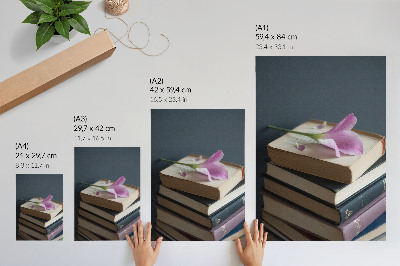 Premium wall art A stack of books with a delicate flower on top