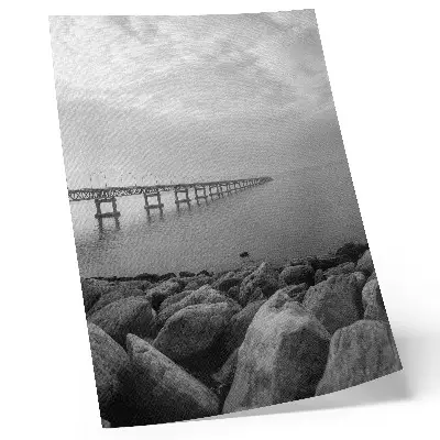 Premium wall art peaceful landscape featuring a bridge over a rocky beach under a gray sky