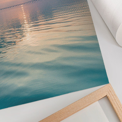 Poster Calm water surface, warm colors of the sky, bridge