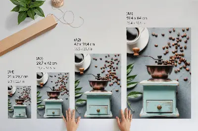 Decorative poster featuring an old turquoise coffee grinder with coffee beans and green leaves