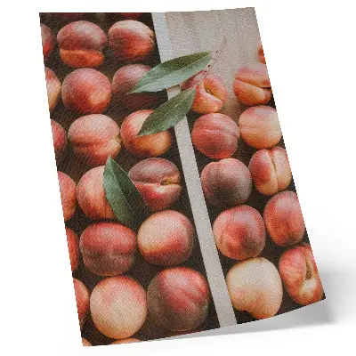 Peaches with leaves in a wooden box poster
