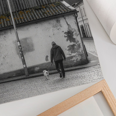 Art print A person with a dog in front of an old building