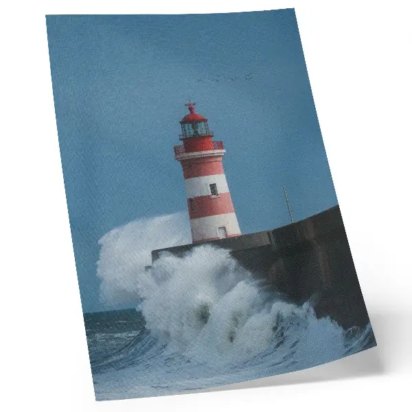 Lighthouse poster featuring blue sky and sea waves