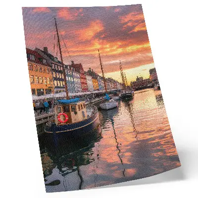 Art print colorful tenement houses with water reflections under a warm sky
