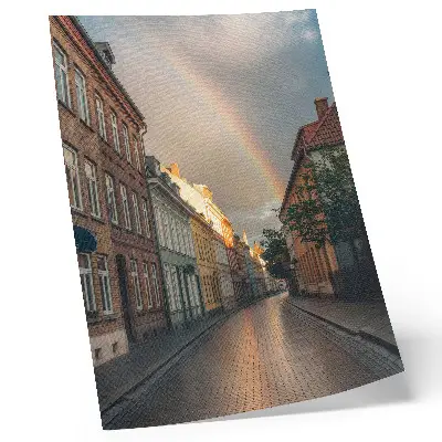 Poster colorful tenement houses with a rainbow against a cloudy sky