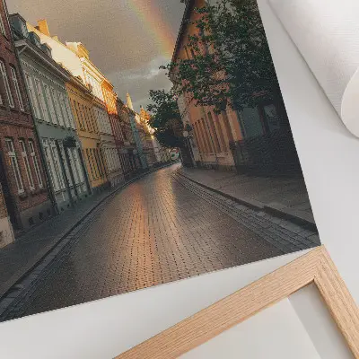 Poster colorful tenement houses with a rainbow against a cloudy sky