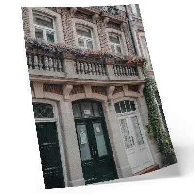 Poster flowers on the balcony with a brick facade in a classic style