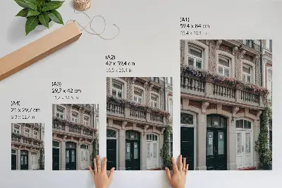 Poster flowers on the balcony with a brick facade in a classic style