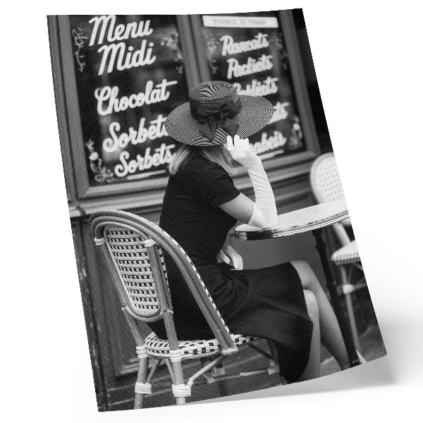 Art print A woman wearing a hat at a table in a cafe