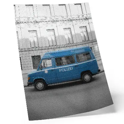 Police car poster blue car with a building in the background