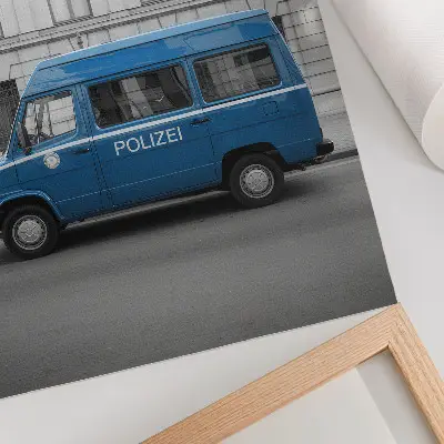 Police car poster blue car with a building in the background