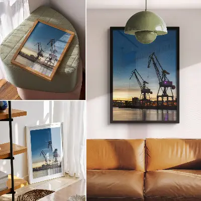 Poster cranes against a dynamic sunset backdrop
