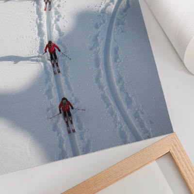 Decorative poster Skiers in the snow wearing red jackets