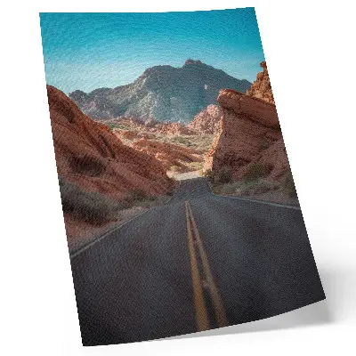 Art print road with rocky mountains under a blue sky