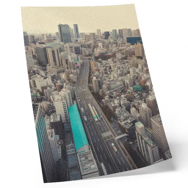 Decorative poster panorama of the city with tall buildings and a road
