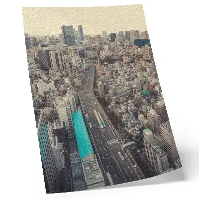Decorative poster panorama of the city with tall buildings and a road