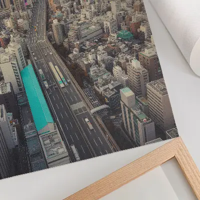 Decorative poster panorama of the city with tall buildings and a road