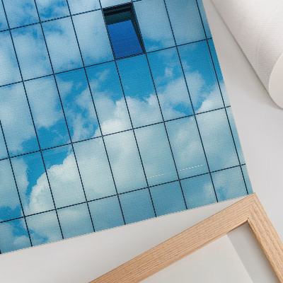 Poster A glass facade reflecting the sky and clouds