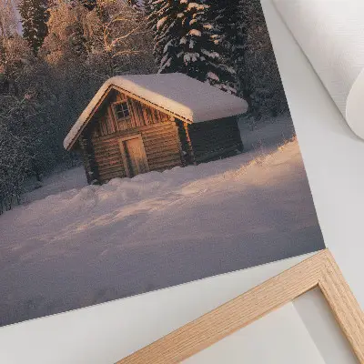 Decorative poster featuring a peaceful winter forest scene with a wooden cottage