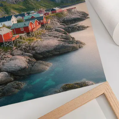 Decorative poster featuring charming cottages, a calm sea, and majestic mountains