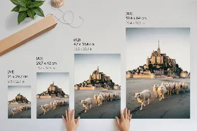Poster featuring a peaceful landscape with a castle, hills, sheep, and sand