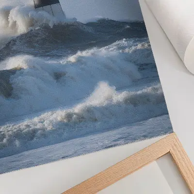 Poster waves hitting the lighthouse depicting the power of nature in high contrast