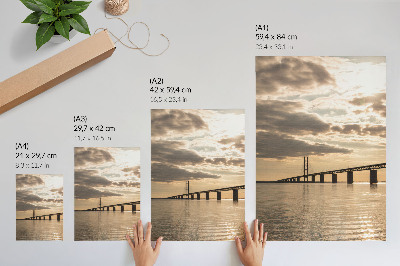 Poster A bridge over the water in the light of the setting sun