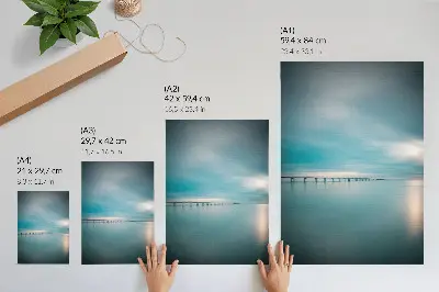A bridge over calm blue waters poster